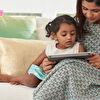 Mother showing something her daughter on tablet
