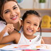 Mother and daughter smiling