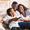 Family Enjoying Time Together While Watching TV