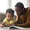 Father and Son Reading Book Together