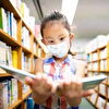 Girl Focusing on Reading Book