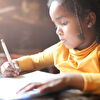 Girl Writing in Sunlight