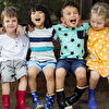 Group of Little Kids Enjoying Time Together on Bench
