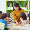 Kindergarten Teacher Holding Art Session