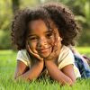 Little Girl Lying in the Grass