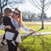 Mother Showing Info Board to Daughter
