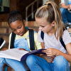Schoolgirls Sitting on Stairs