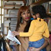 Woman With Girl in Library