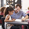 Young Teacher Assisting